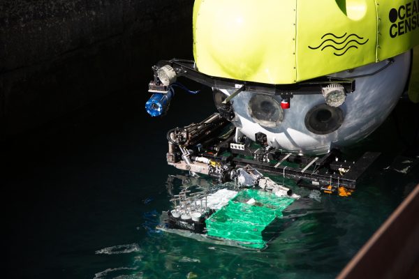 Research submarine with science samples being lifted out of the water
